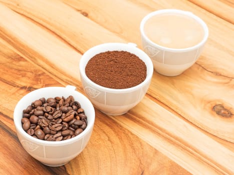 three cups of coffee,coffee beans and coffee powder