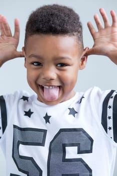 young boy pulling a face at the camera