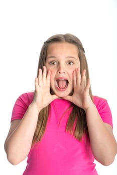 Young girl gesturing a shout at the camera. She is standing against a white background.