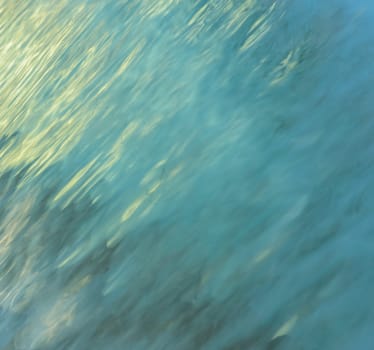 Blurred abstract background of light reflection on water motion