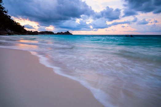 Beautiful beach and sea waves at sunset in summer on Koh Miang island, Mu Koh Similan National Park, Phang Nga Province, Thailand.