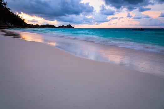 Beautiful beach and sea waves at sunset in summer on Koh Miang island, Mu Koh Similan National Park, Phang Nga Province, Thailand.