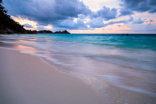 Beautiful beach and sea waves at sunset in summer on Koh Miang island, Mu Koh Similan National Park, Phang Nga Province, Thailand.