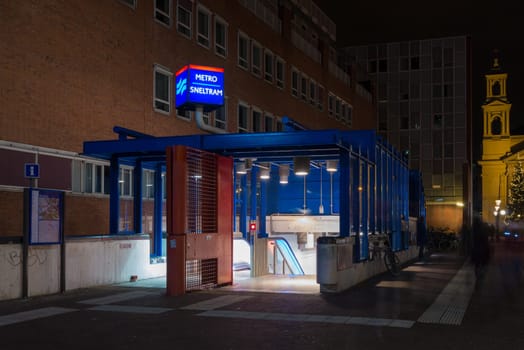 entrance of an amsterdam metro station at night