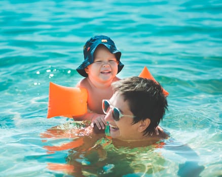 Baby and mother in a sea
