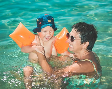 Baby and mother in a sea