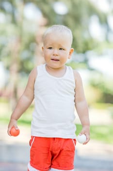 Baby boy playing toy golf outdoor