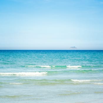 Tropical sandy beach at summer sunny day
