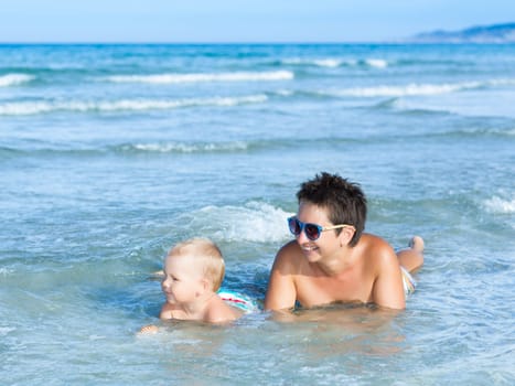 Baby and mother in a sea