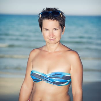 Happy woman near a sea