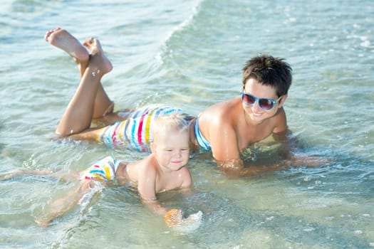 Baby and mother in a sea
