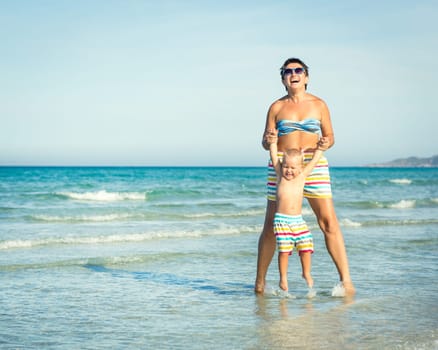 Baby and mother in a sea