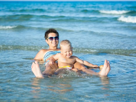 Baby and mother in a sea