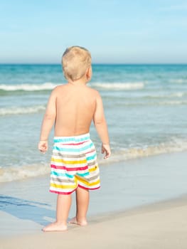 Baby looking sea on the beach
