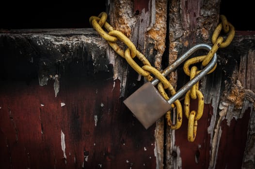 Old master key on old wooden door and shadow background, Selective focus