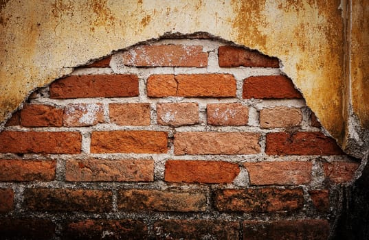 Old grunge brick wall dark border background