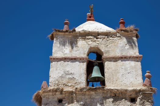 Historic 17th century church in the small village of Parinacota, located at an elevation of 4,400 metres in Lauca National Park and on the altiplano of northern Chile.