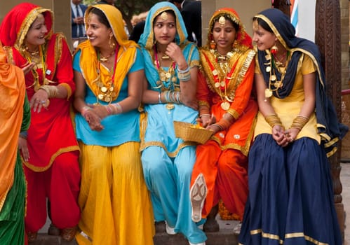 Group of colorfully dressed Indian ladies at the annual Surajkund Fair in Haryana on the outskirts of Delhi, India