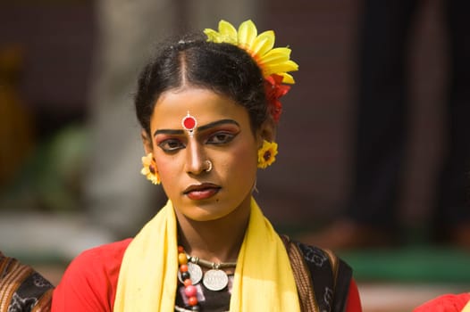 Indian dancer in traditional tribal outfit at the annual Sarujkund Craft Fair in Haryana near Delhi, India.