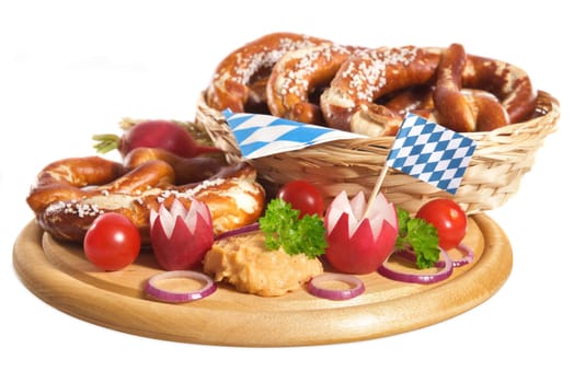 Bavarian vegetarian breakfast with pretzels and obazda on wooden board