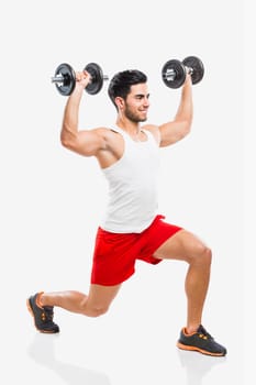 Portrait of handsome young man lifting weights, isolated on white background