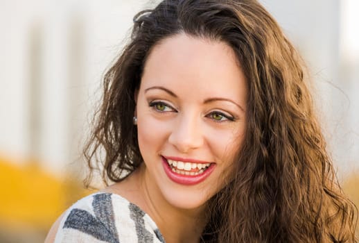 Outdoor portrait of a beautiful and fresh young woman