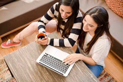 Female friends studying at the local coffee shop