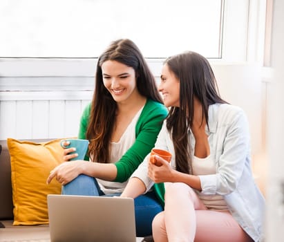 Female friends studying at the local coffee shop