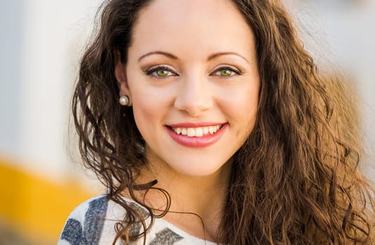Outdoor portrait of a beautiful and fresh young woman