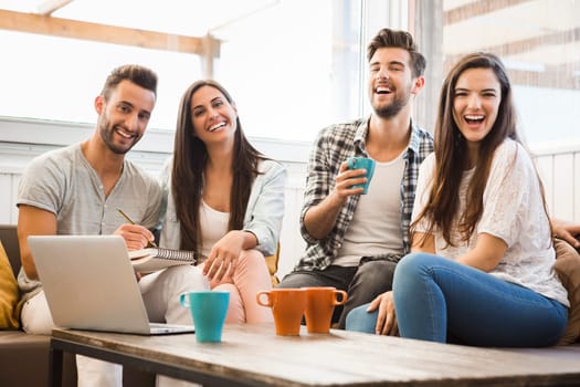 Group of friends study at the local coffee shop