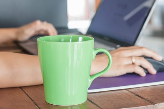 Coffee mug in coffee shop, stock photo