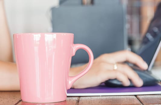Coffee mug in coffee shop, stock photo