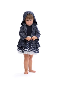 Little girl angry in the hood with polka dots. Isolate on white.