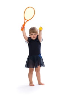 Little girl playing tennis in the studio. Isolate on white.