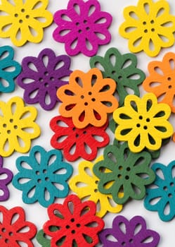 Colorful abstract background of bright objects in the form of flowers on a light background
