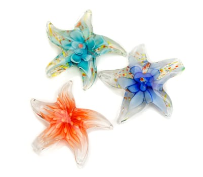 Three stars out of Murano glass isolated on white background.