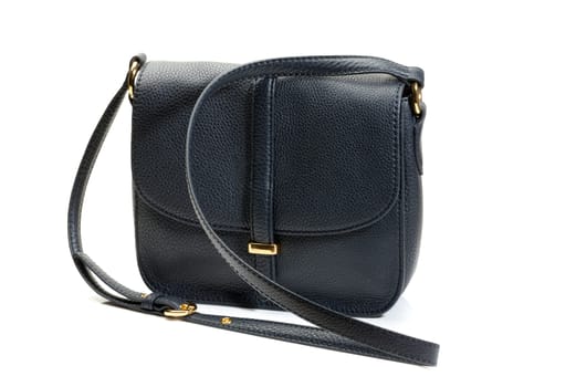 Luxury female handbag over white background.