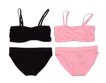 Two sets of lingerie, pink and black. Isolate on white.