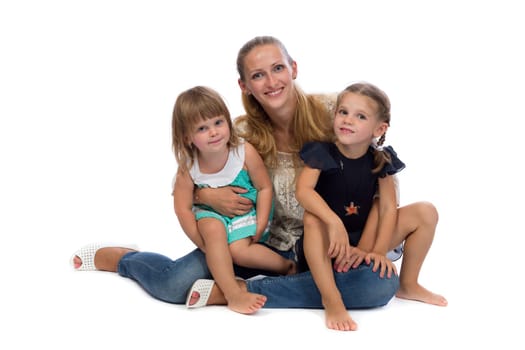 Family portrait of a young charming mother and two daughters, isolate on white background.