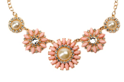 Necklace with pink stones on a gold chain. Clos-up. Isolate on white.