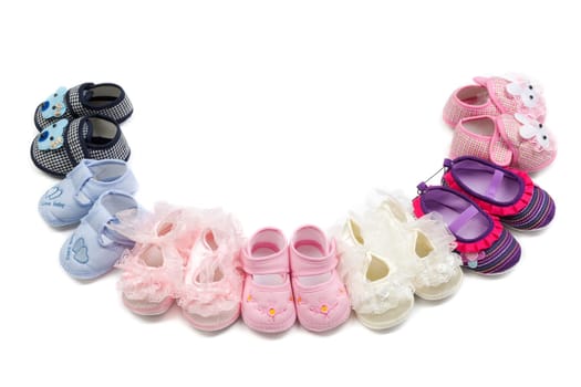 Children's shoes laid in a semicircle. Isolate on white.