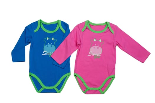 Two blue and pink baby clothes with print hippopotamus. Isolate on white.