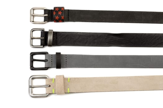 Four leather strap with buckles. Isolate on white.