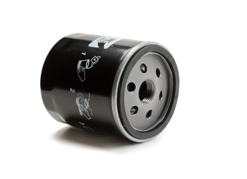 Black car oil filter. Isolate on white.