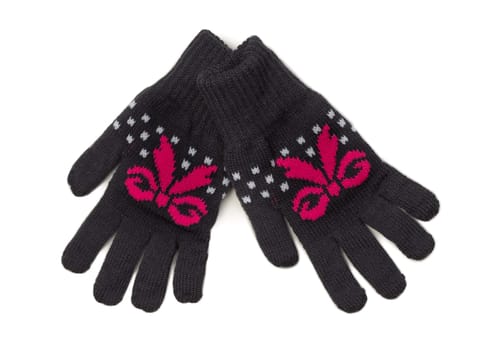 Pair of black knitted gloves with a red pattern. Isolate on white.