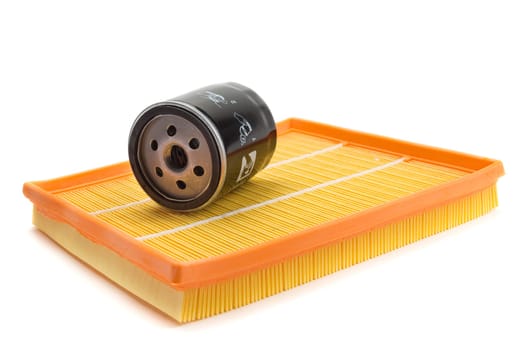 Set of two air filters and oil filter isolated on white.
