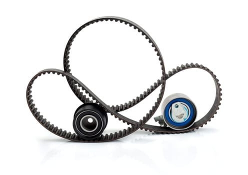 Timing belt, pulley and tensioner. Isolate on white.