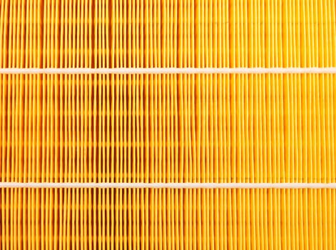 Background of a yellow car air filter closeup.
