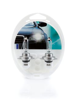 Two lamps H7 for car headlights in plastic blister, isolate on white