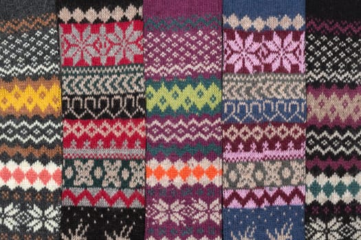 Dark knitted background with the national winter pattern.